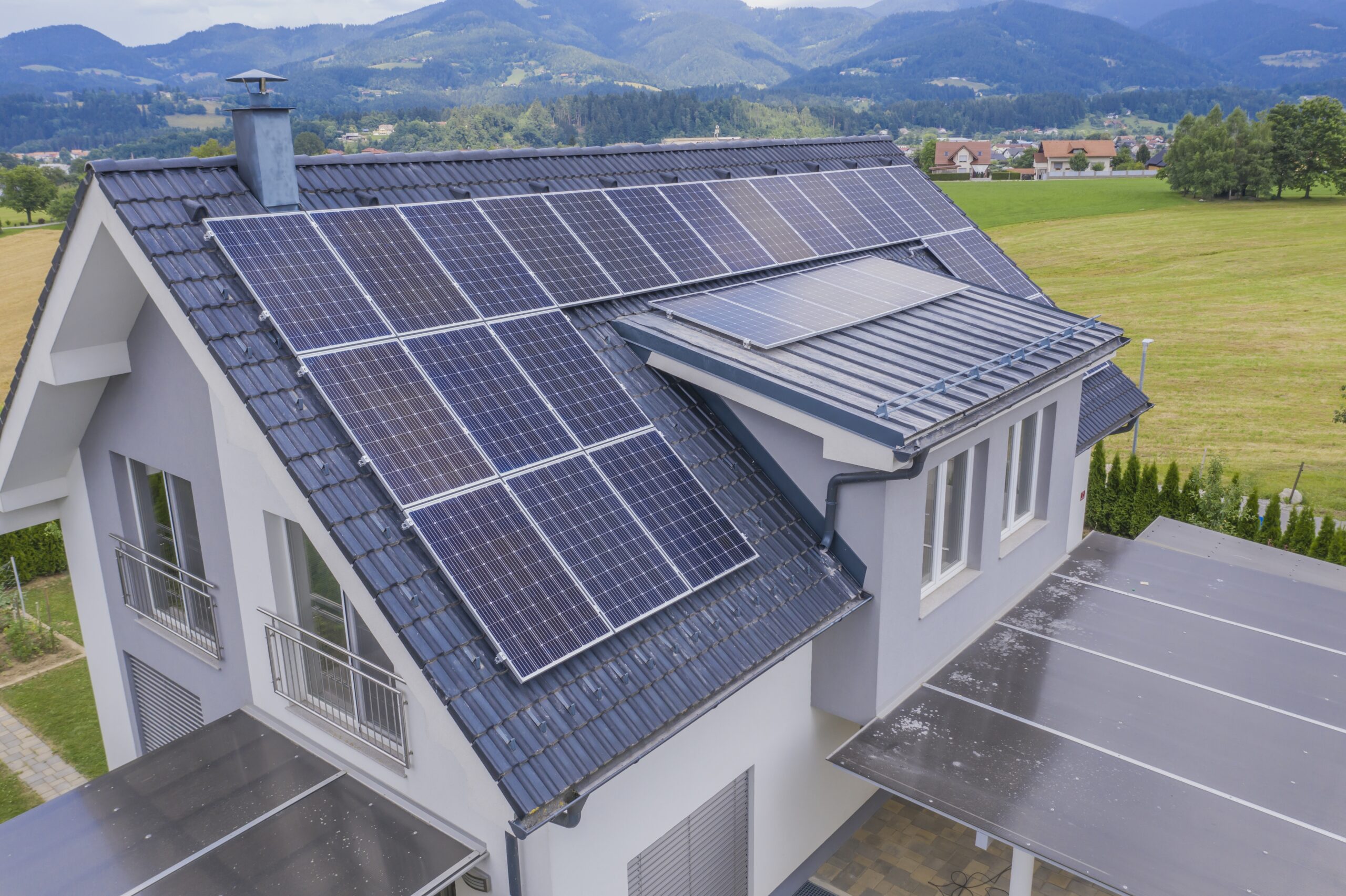 aerial-view-private-house-with-solar-panels-roof-scaled-1